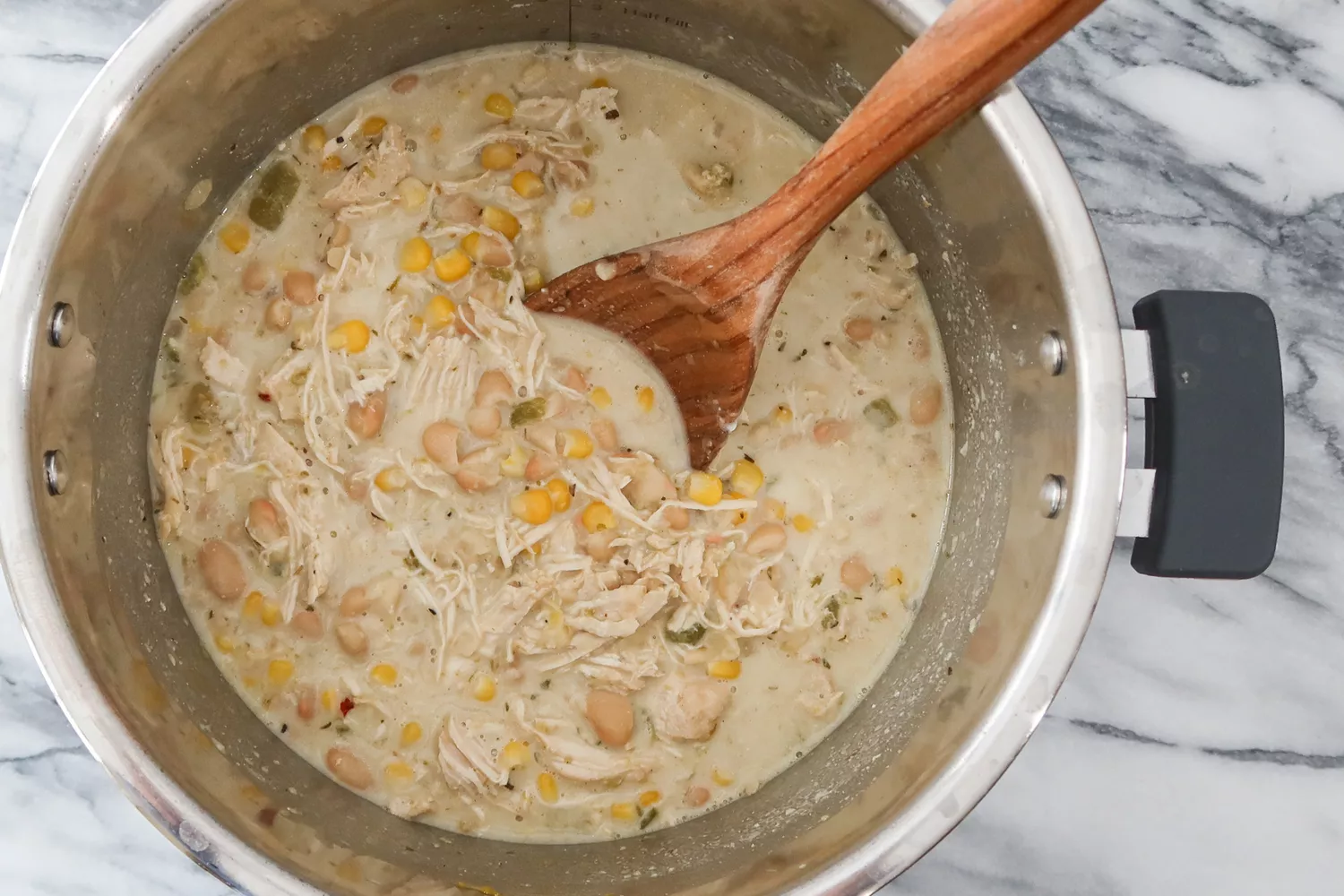 add the sour cream and cheese to the instant pot white chicken chili