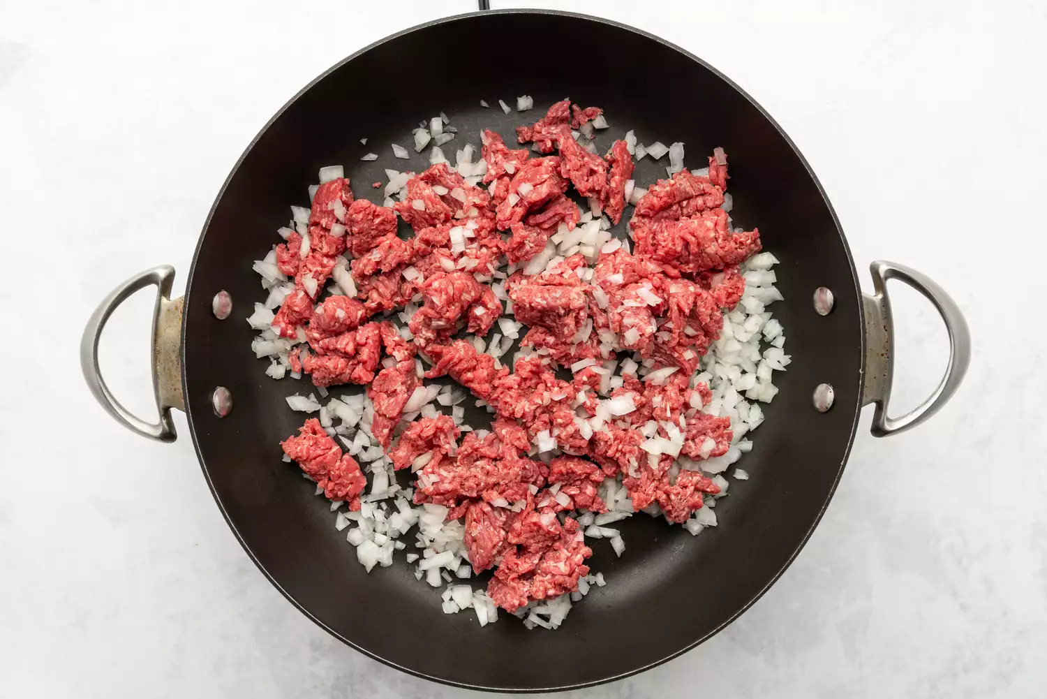 beef and onions in a pan