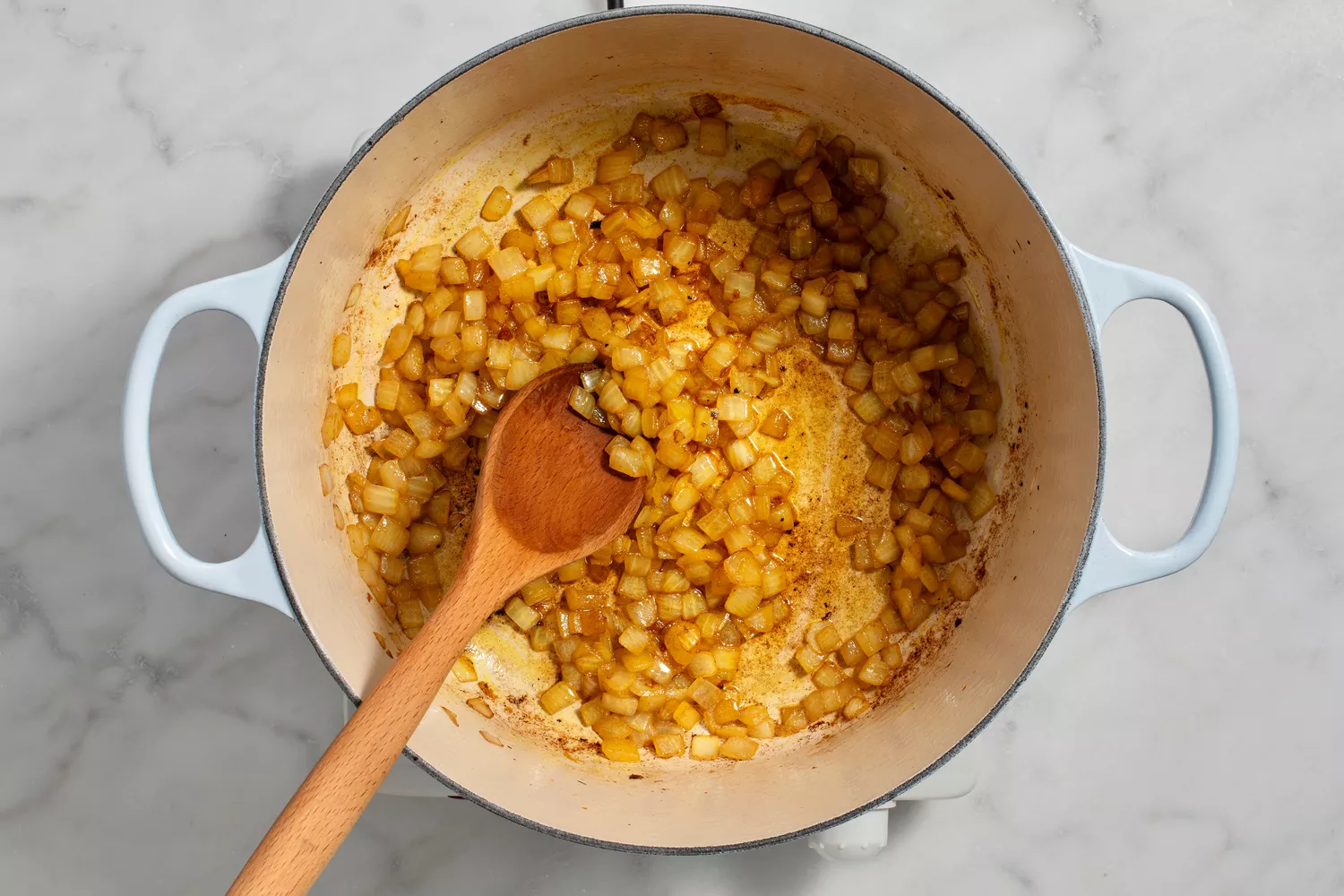 onion and turmeric sauteeing in pot until golden brown