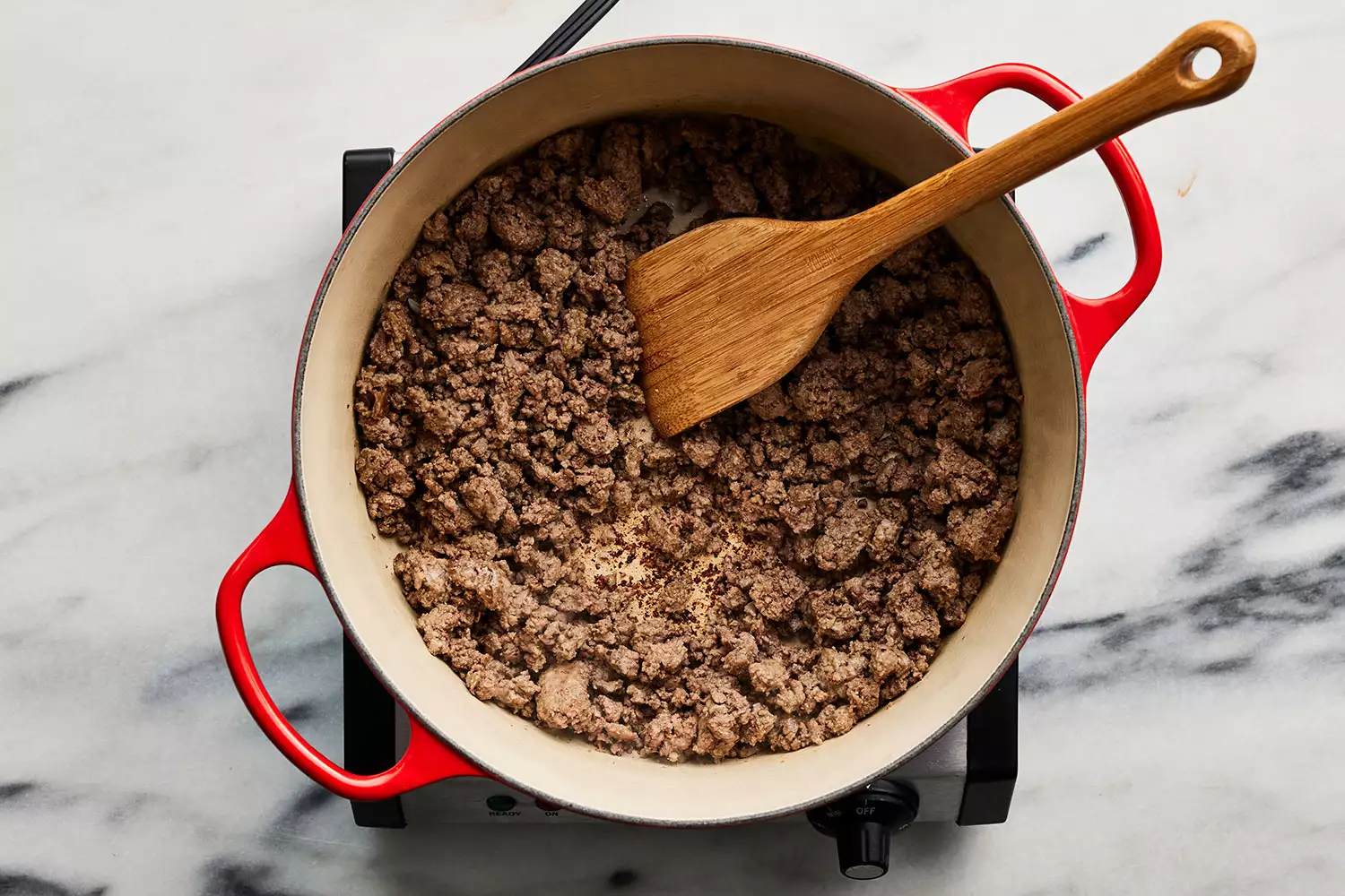 ground meat for Pastitsio filling browned in pot over burner