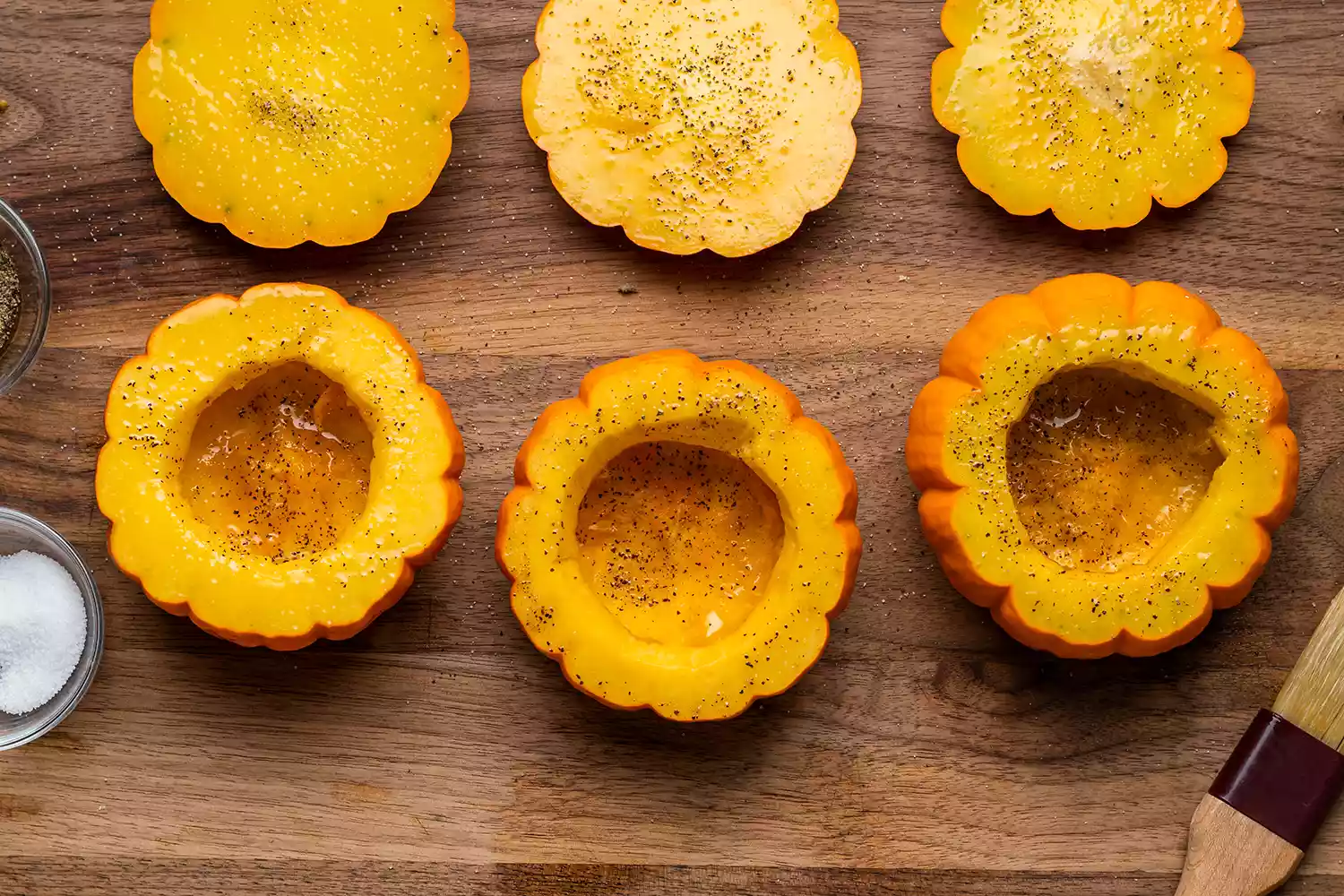 seasoned and oiled sliced open pumpkins