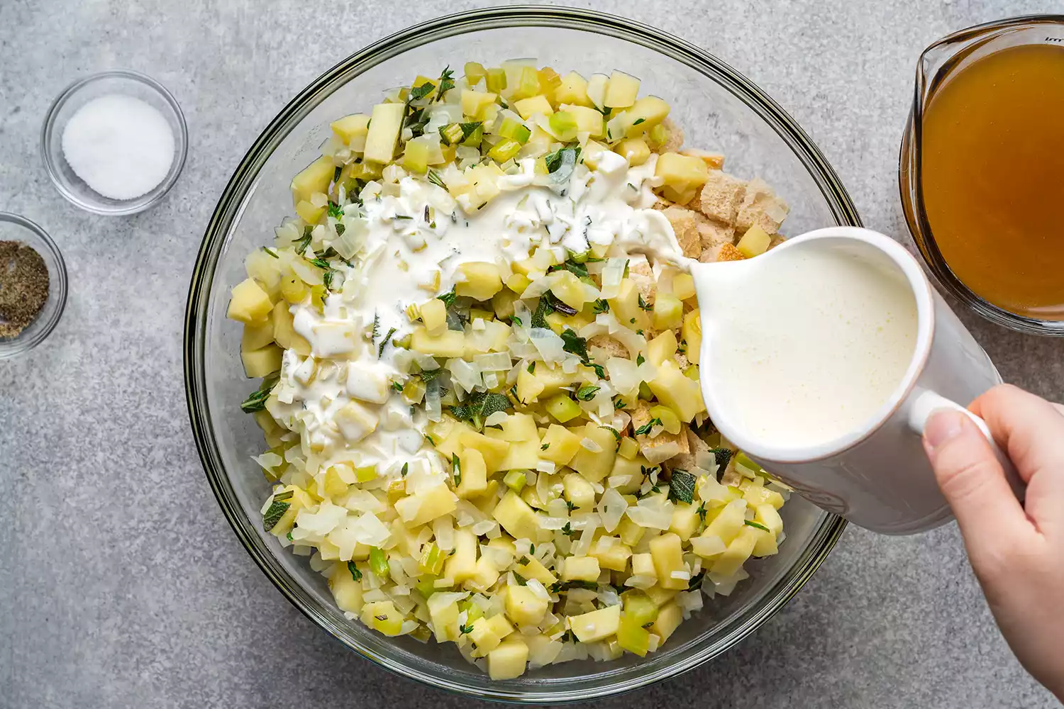 adding cream to stuffing mixture