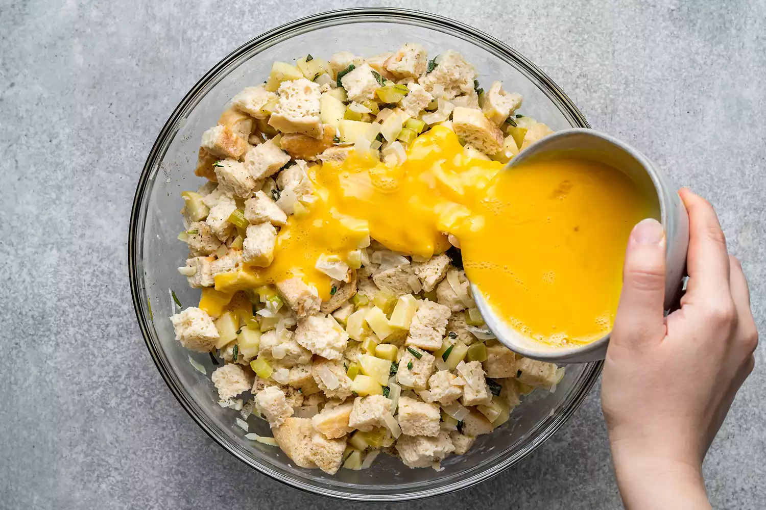 adding beaten eggs to stuffing mixture